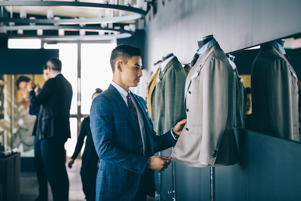 Larry Lim, men's fashion instagram blogger checking Lardini suits